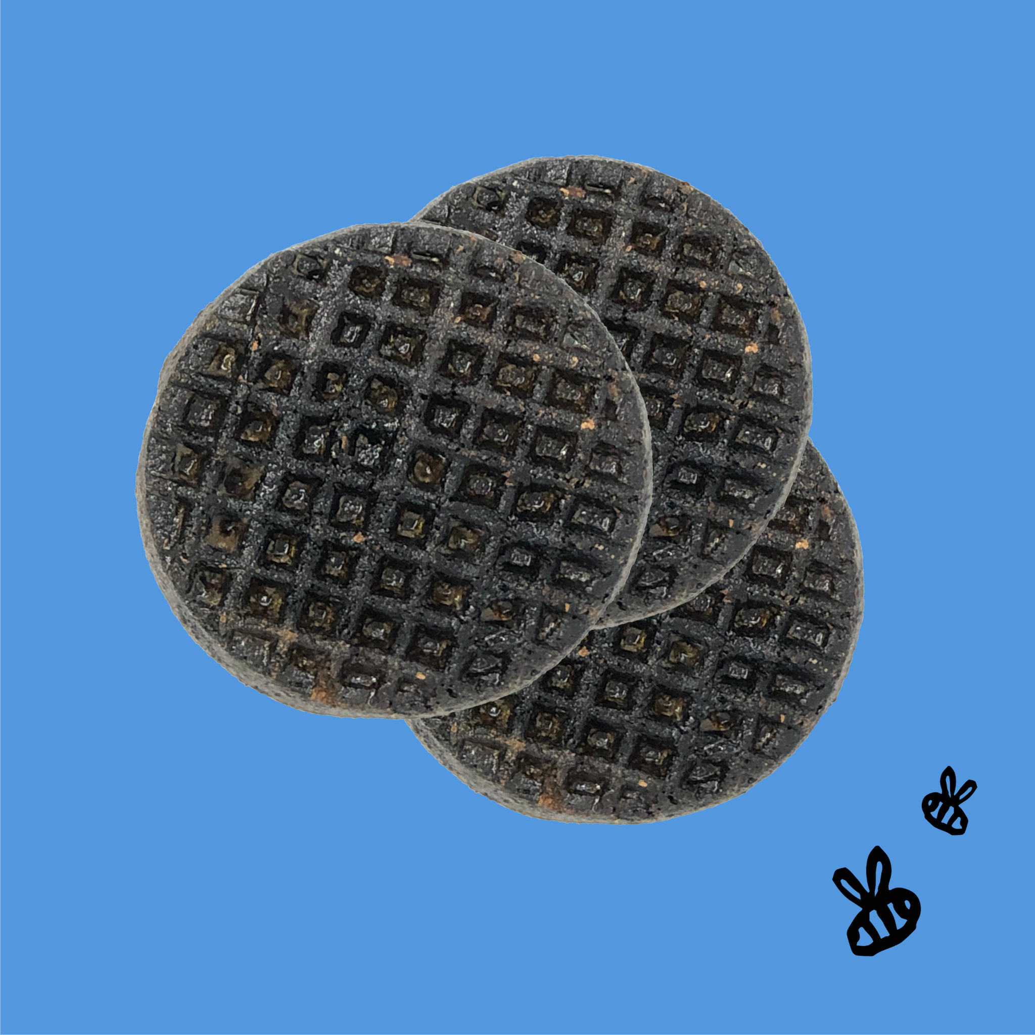3 round buffalo liver recipe wafers for dogs on a bright blue background 2 black bees right corner