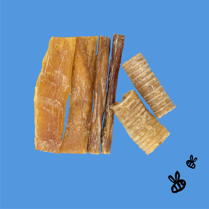 two each, 6" paddywack sticks, 6" bully sticks, trachea tubes on sky blue background